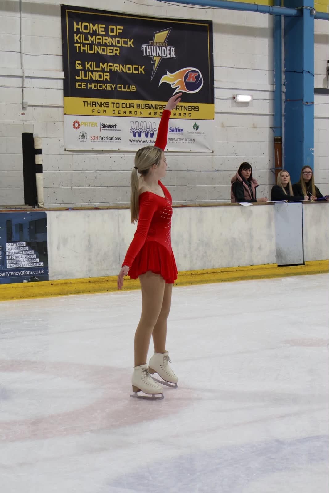 GFSK skater in a red costume on the ice